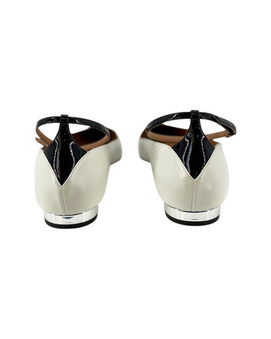 White shoes with black accents on a white background