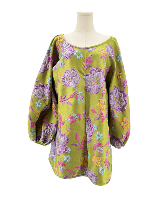 Mannequin wearing a colorful floral patterned Arianne Elmy tunic dress on a white background
