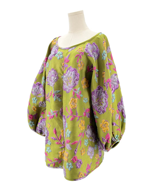 Mannequin wearing a colorful floral patterned Arianne Elmy tunic dress on a white background