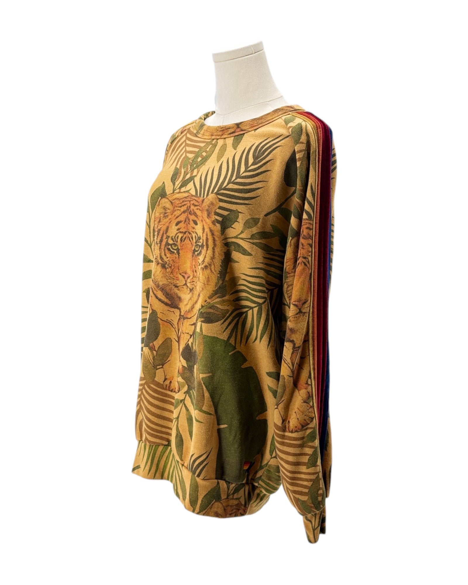 Tropical-themed long-sleeve shirt with tiger design on a mannequin against a white background