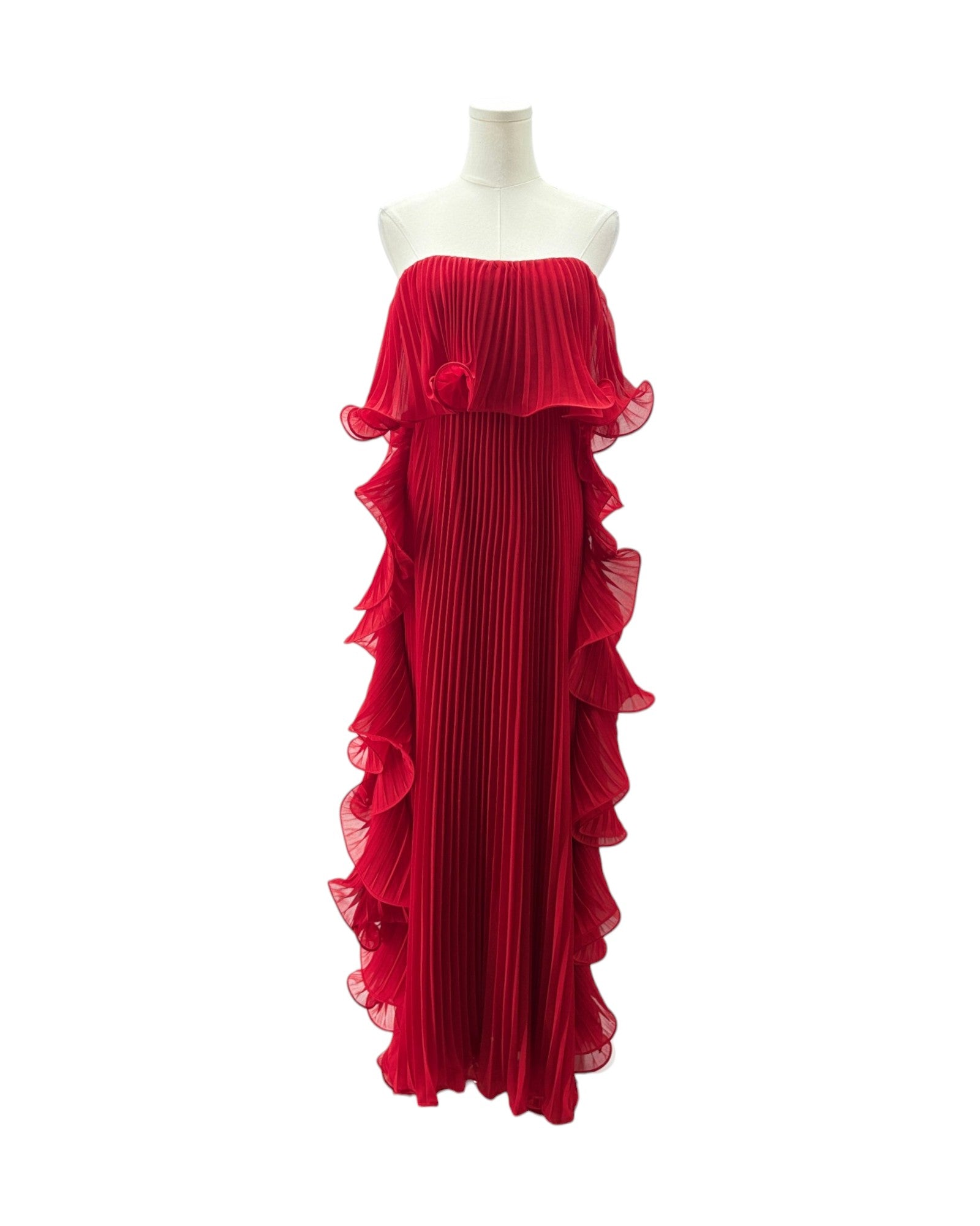 Red evening gown on a mannequin against a white background
