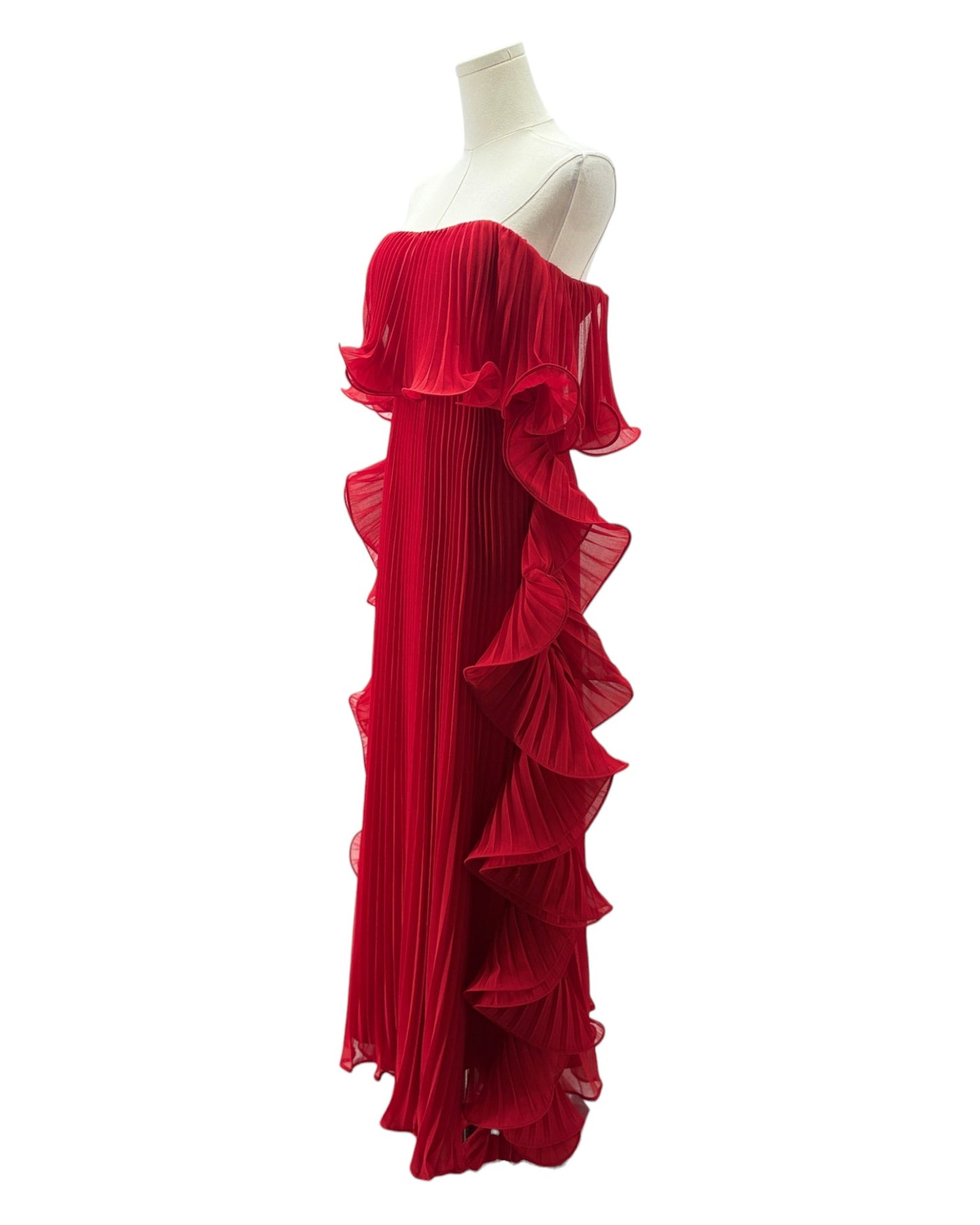 Red ruffled dress on a mannequin against a white background