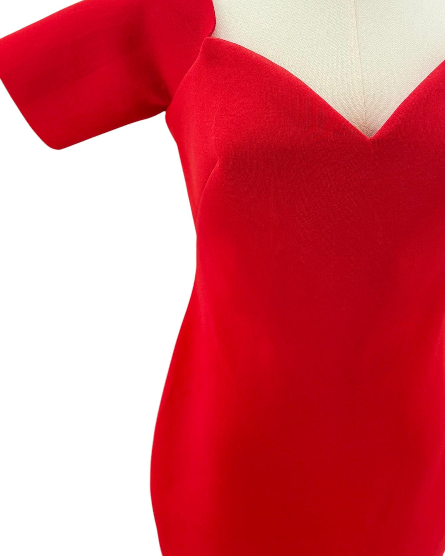 Red dress on a mannequin with a white background