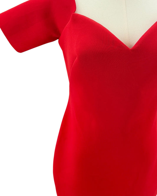 Red dress on a mannequin with a white background
