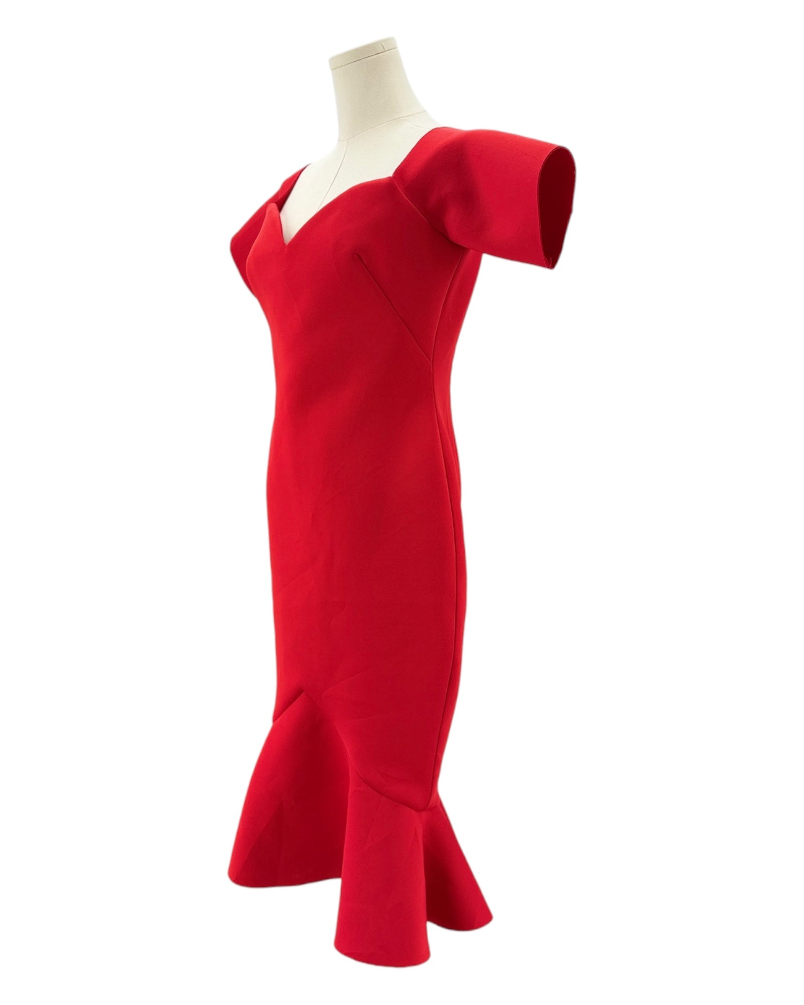 Red dress on a mannequin against a white background