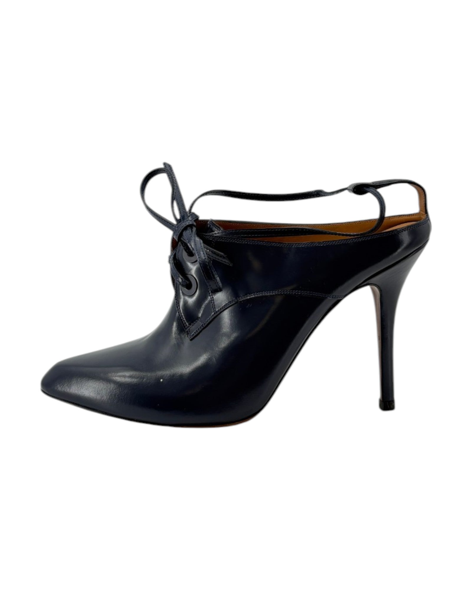 Navy high-heeled shoe with lace-up design on a white background