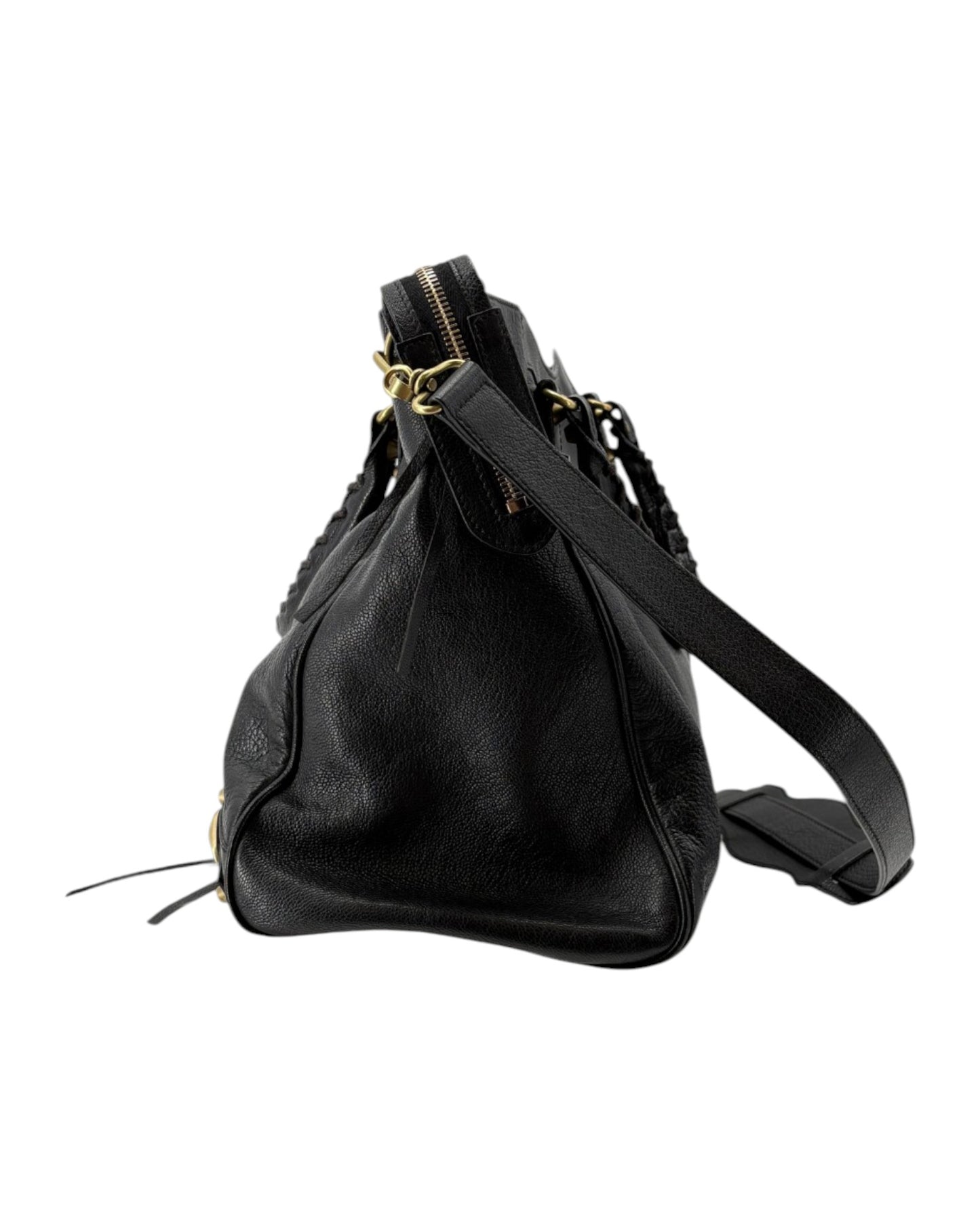 Black leather handbag with gold zipper on a white background