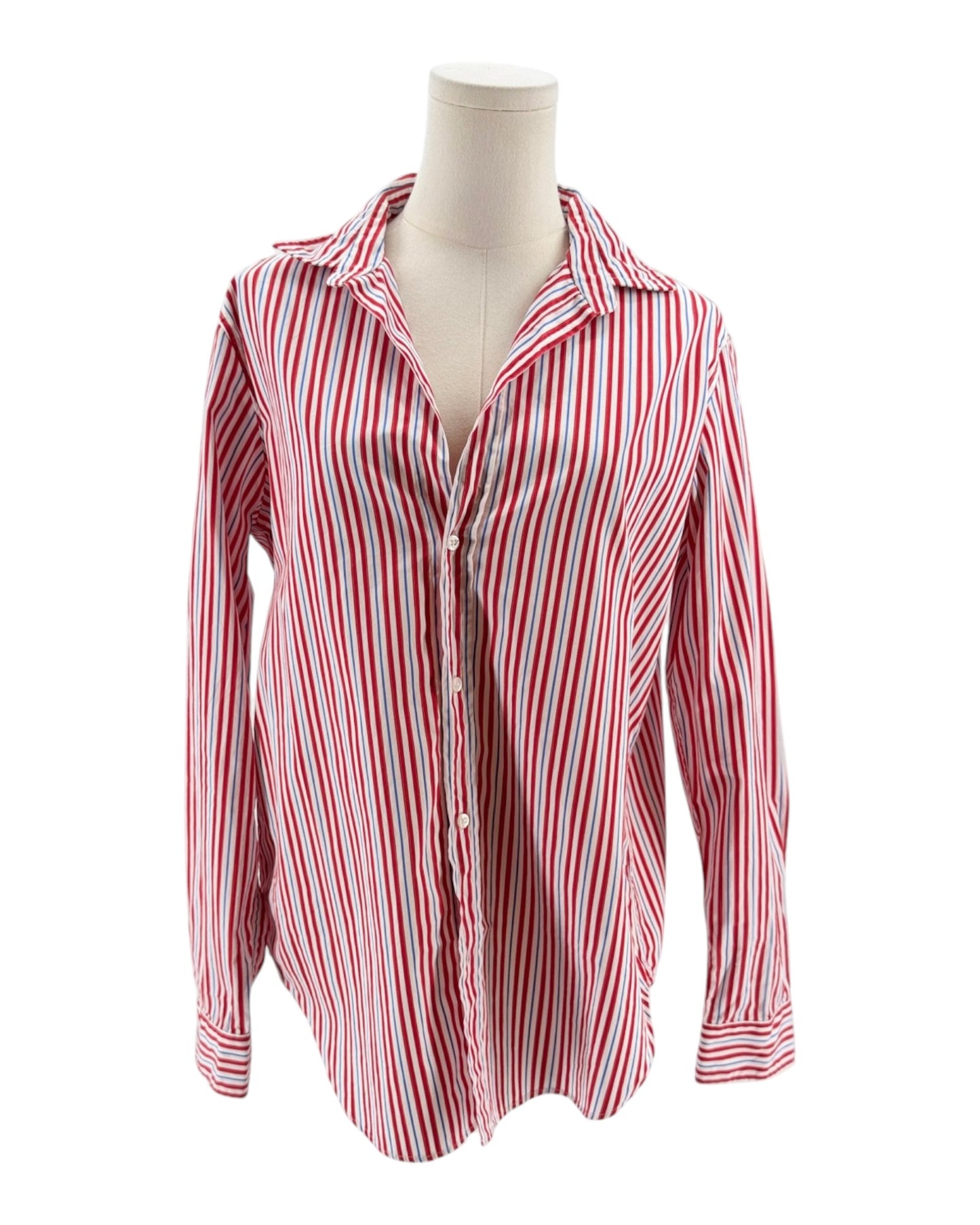 Red and white striped shirt on a mannequin against a white background