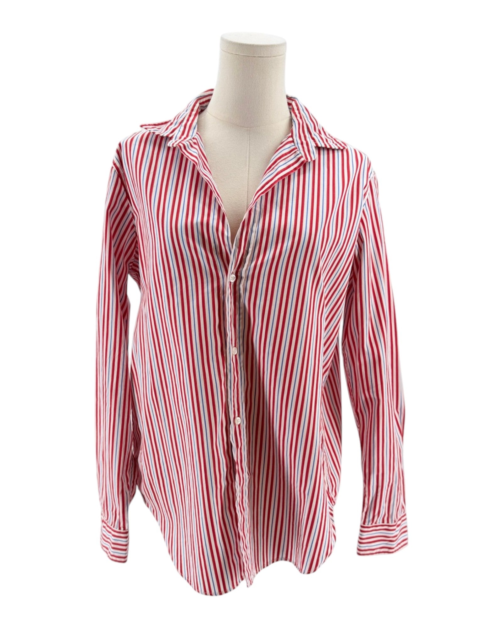 Red and white striped shirt on a mannequin against a white background
