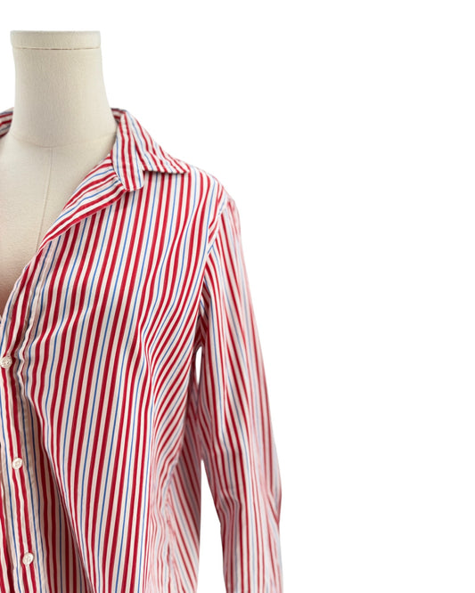 Red and white striped shirt on a mannequin against a white background