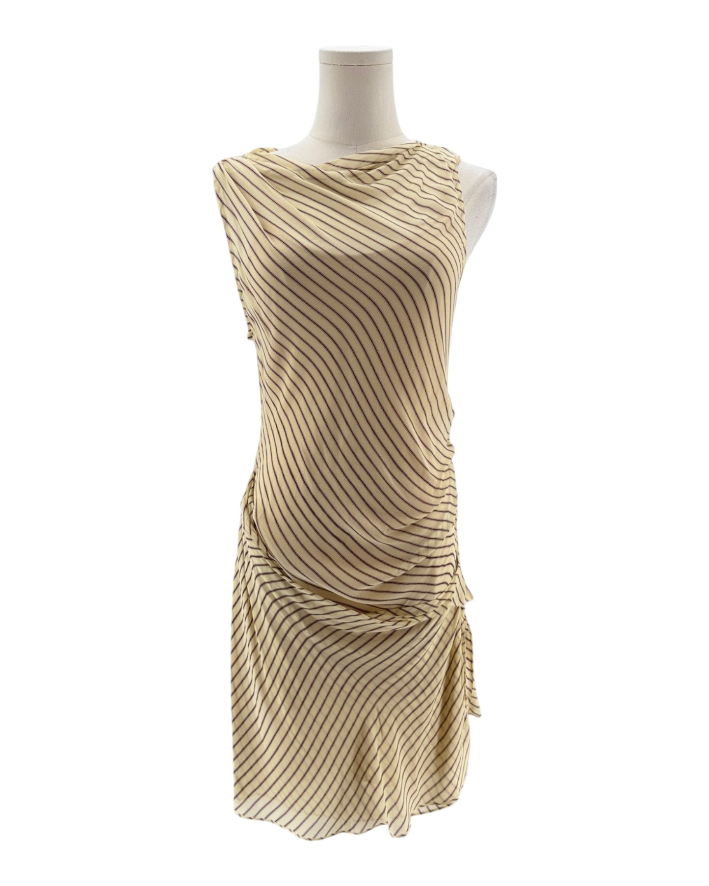 Beige dress on a mannequin against a white background