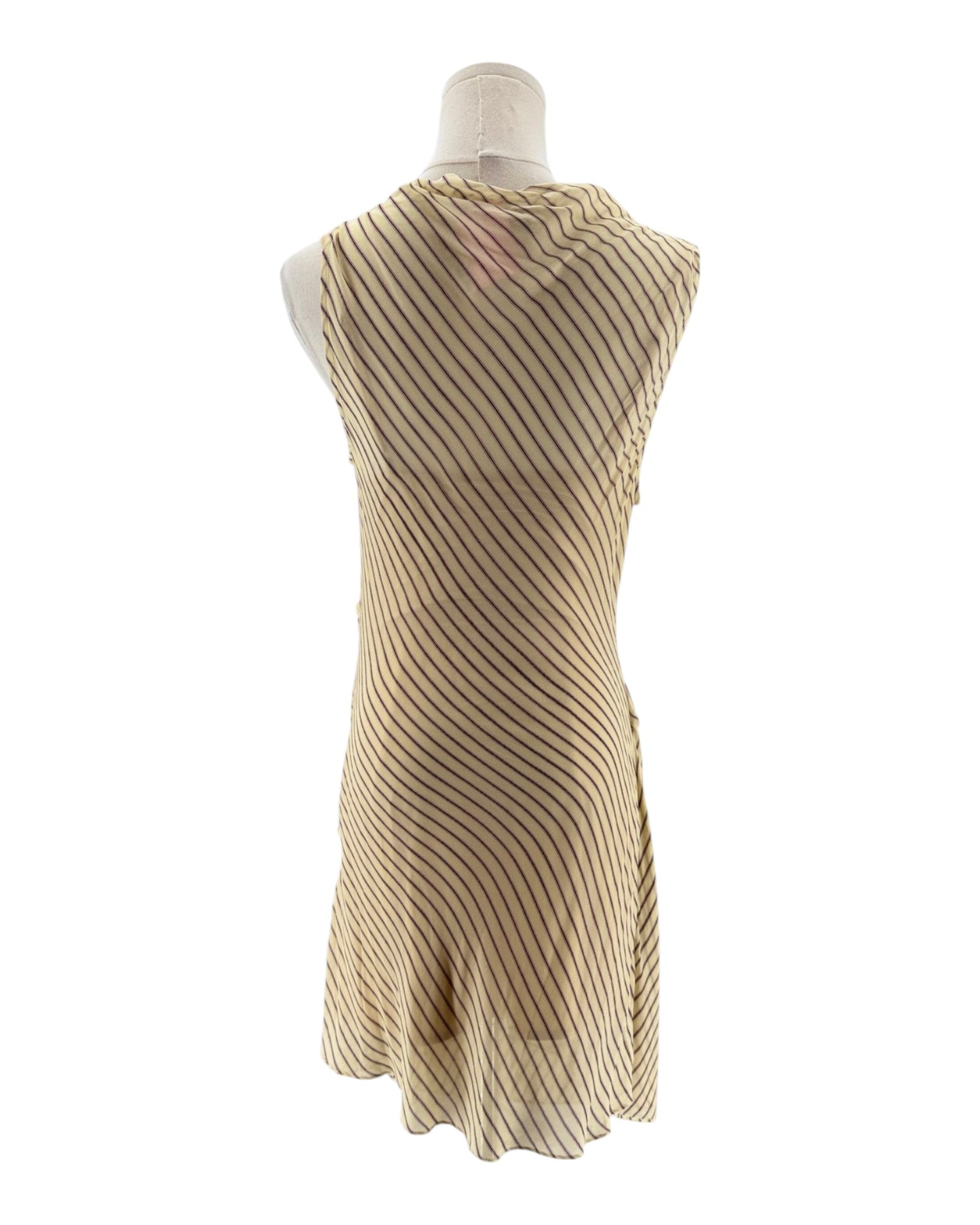 Beige ribbed dress on a mannequin against a white background