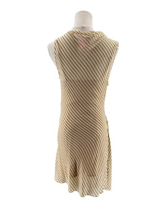 Beige ribbed dress on a mannequin against a white background