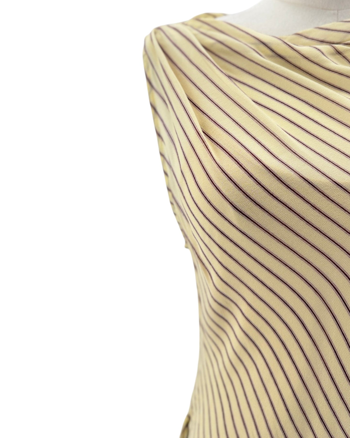 Close-up of a beige and black striped fabric on a white background