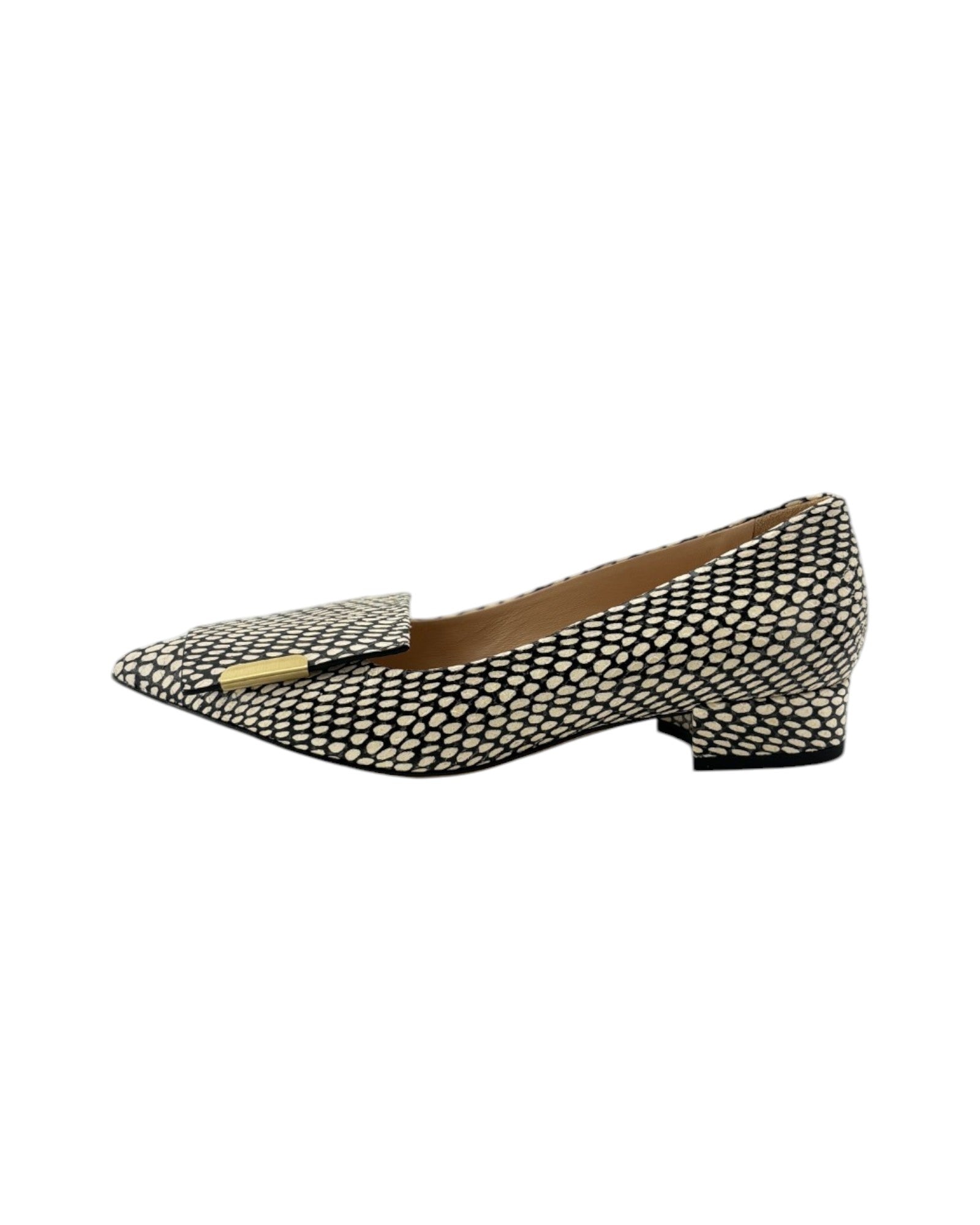 Black and white loafer with black accents on a white background