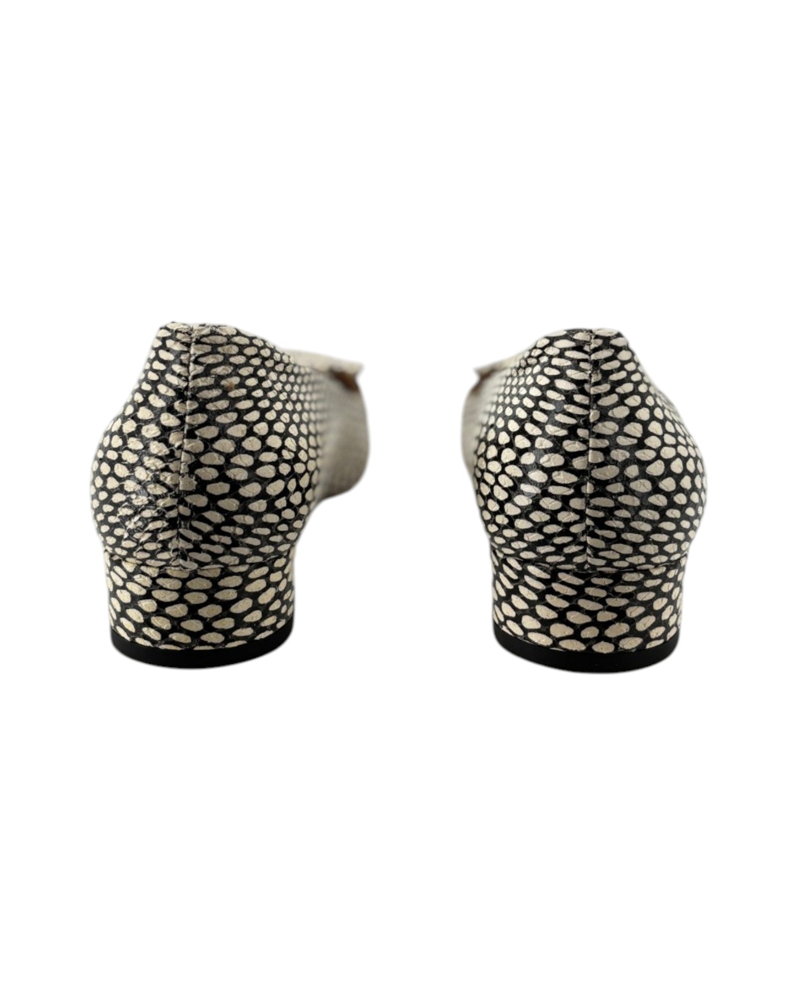 Two black and white patterned shoes on a white background