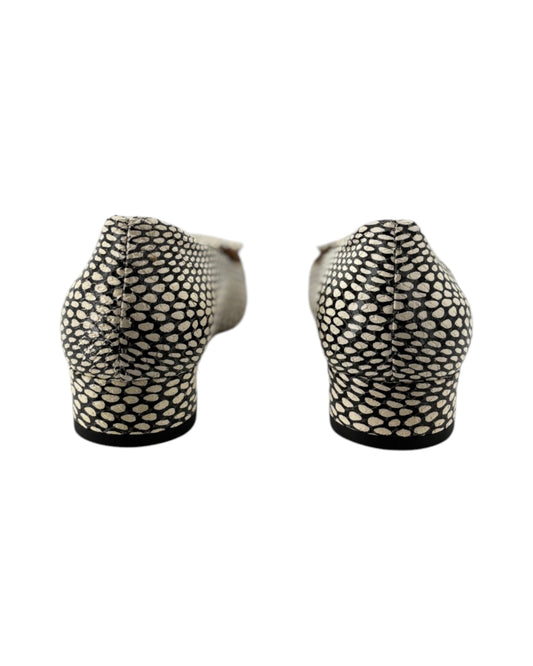 Two black and white patterned shoes on a white background