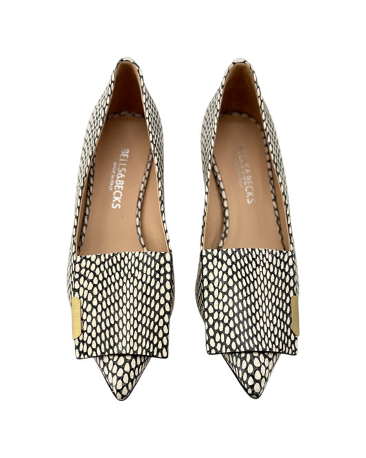 Pair of pointed-toe shoes with patterned design on a white background