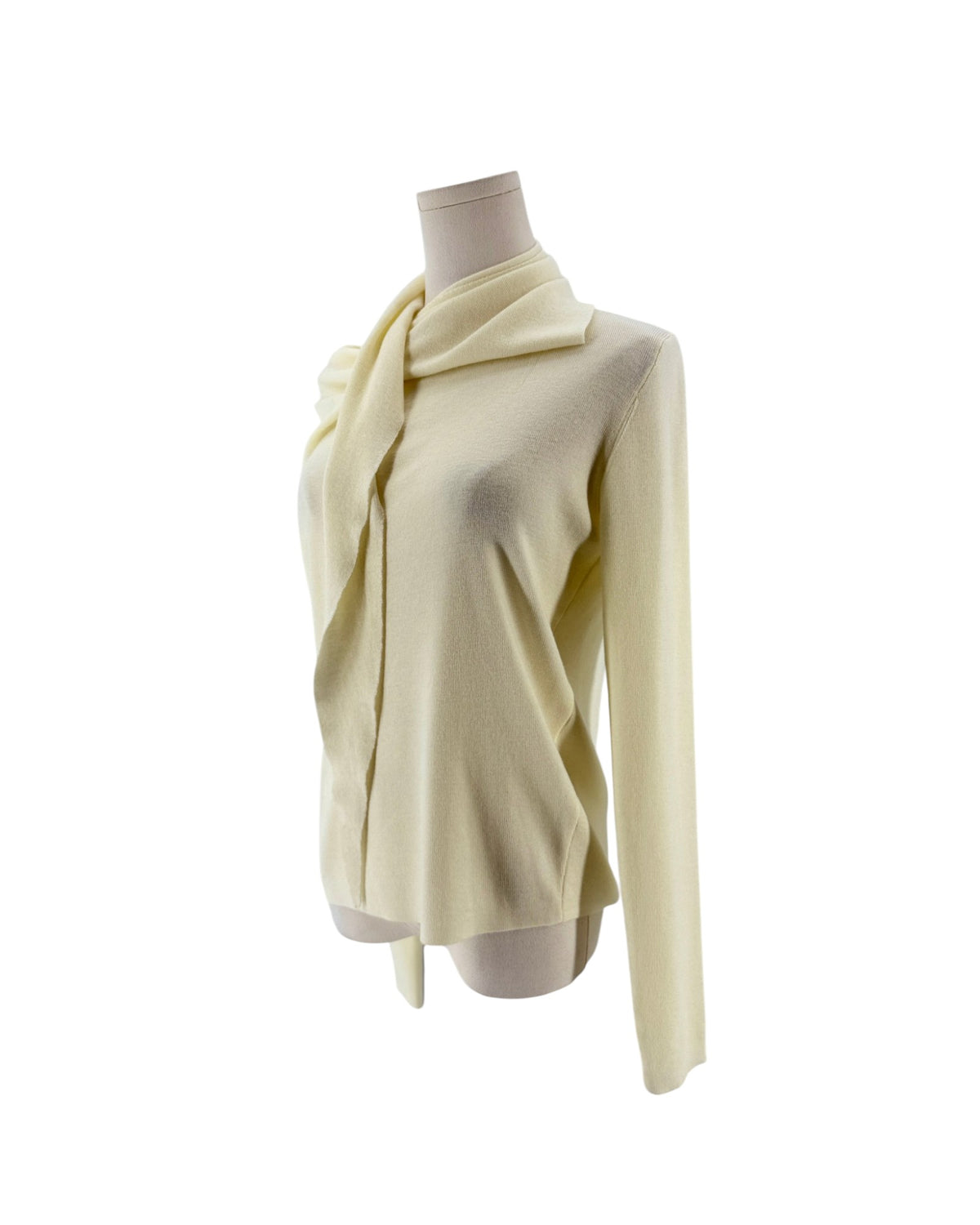 Long sleeve cream sweater with built in scarf neckline on a mannequin on a white background