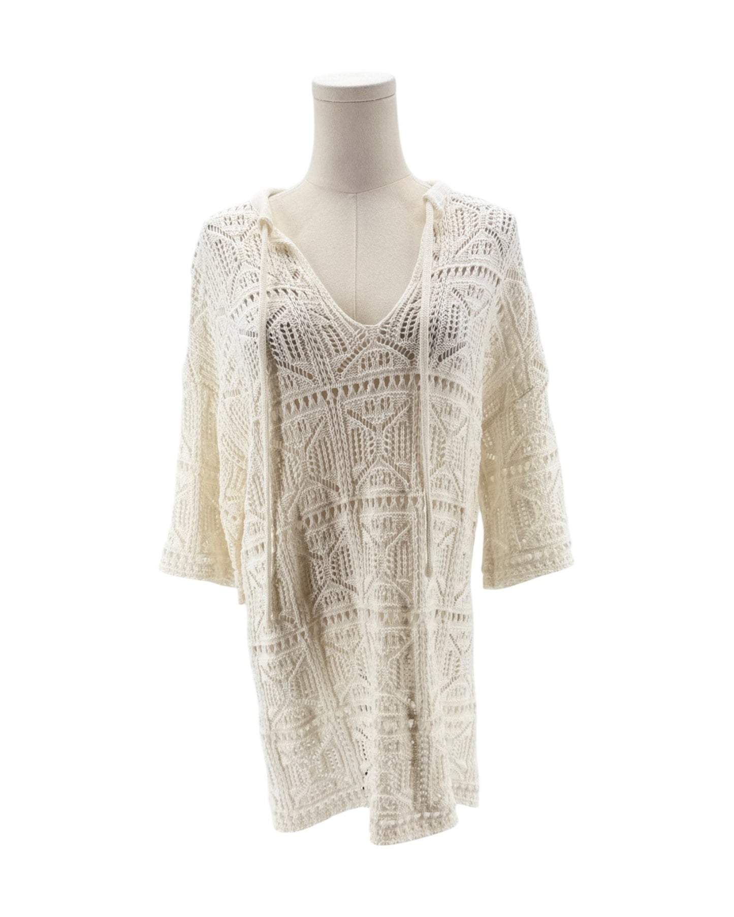 White lace dress on a mannequin against a white background