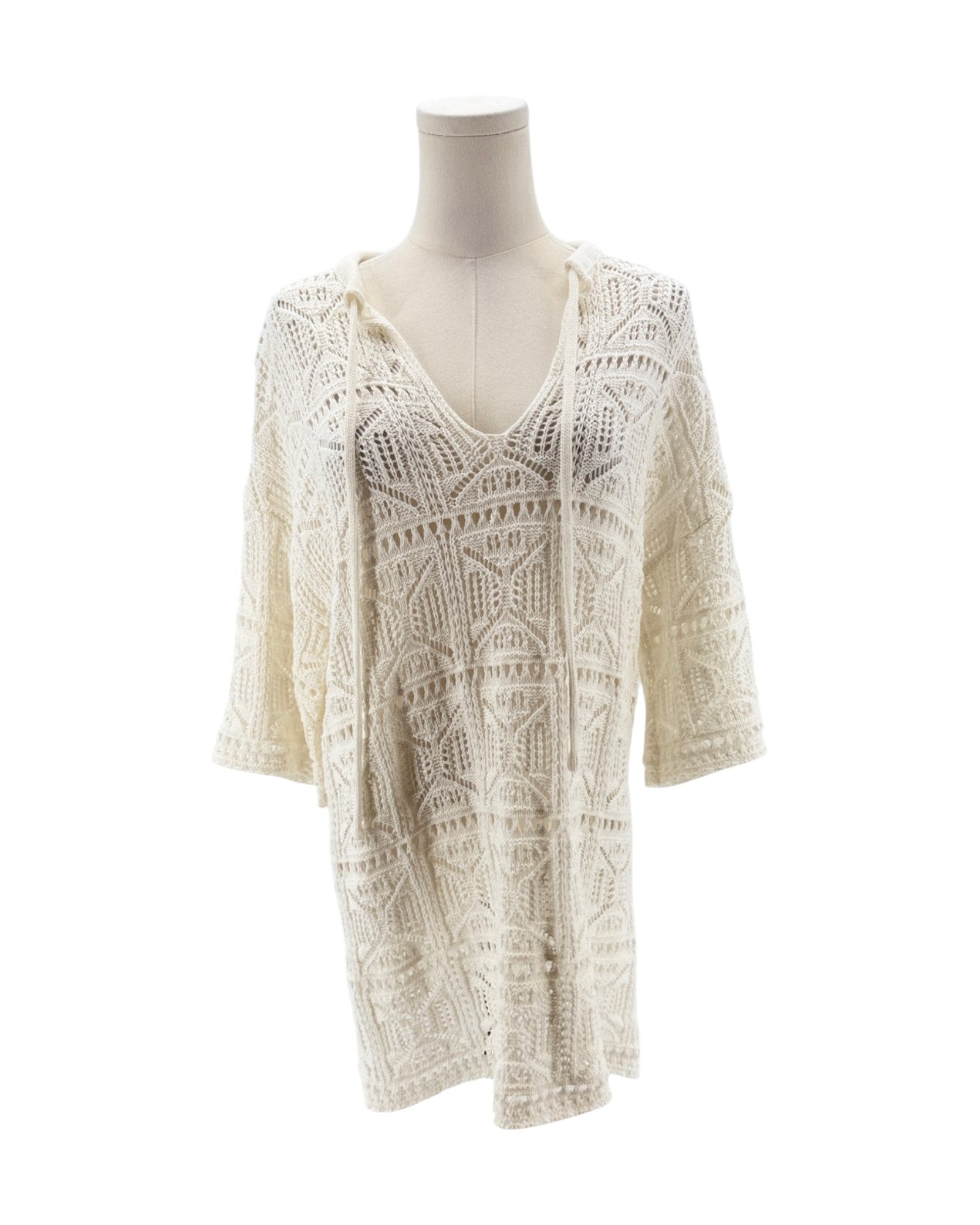 White lace dress on a mannequin against a white background