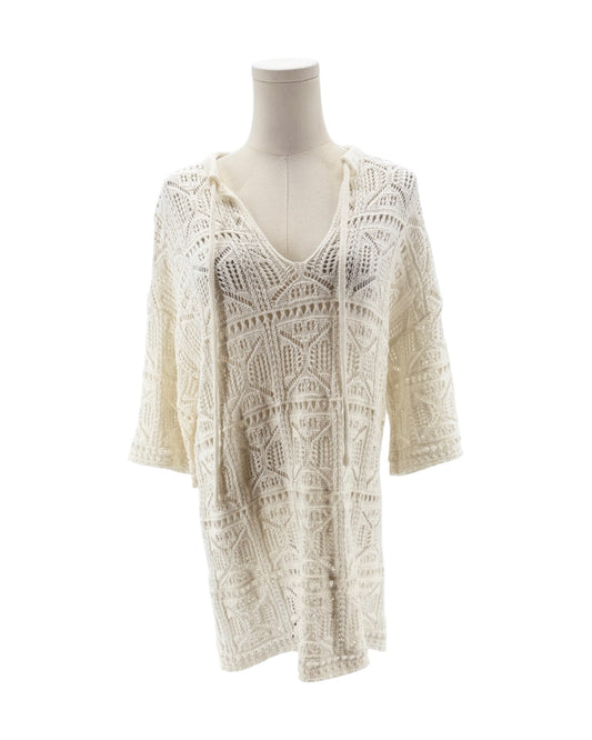 White lace dress on a mannequin against a white background