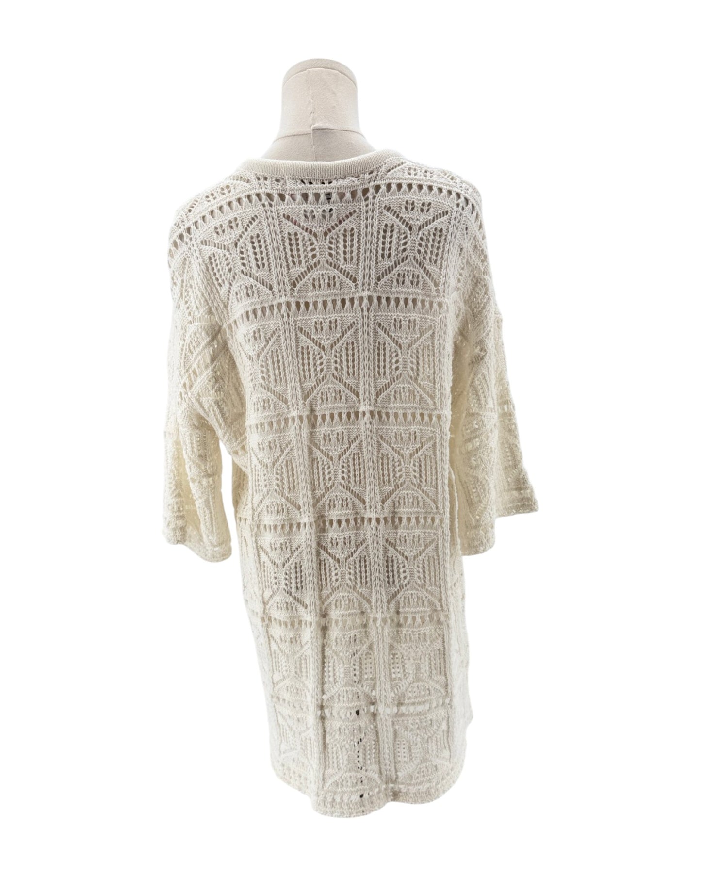 Knit dress on a mannequin against a white background