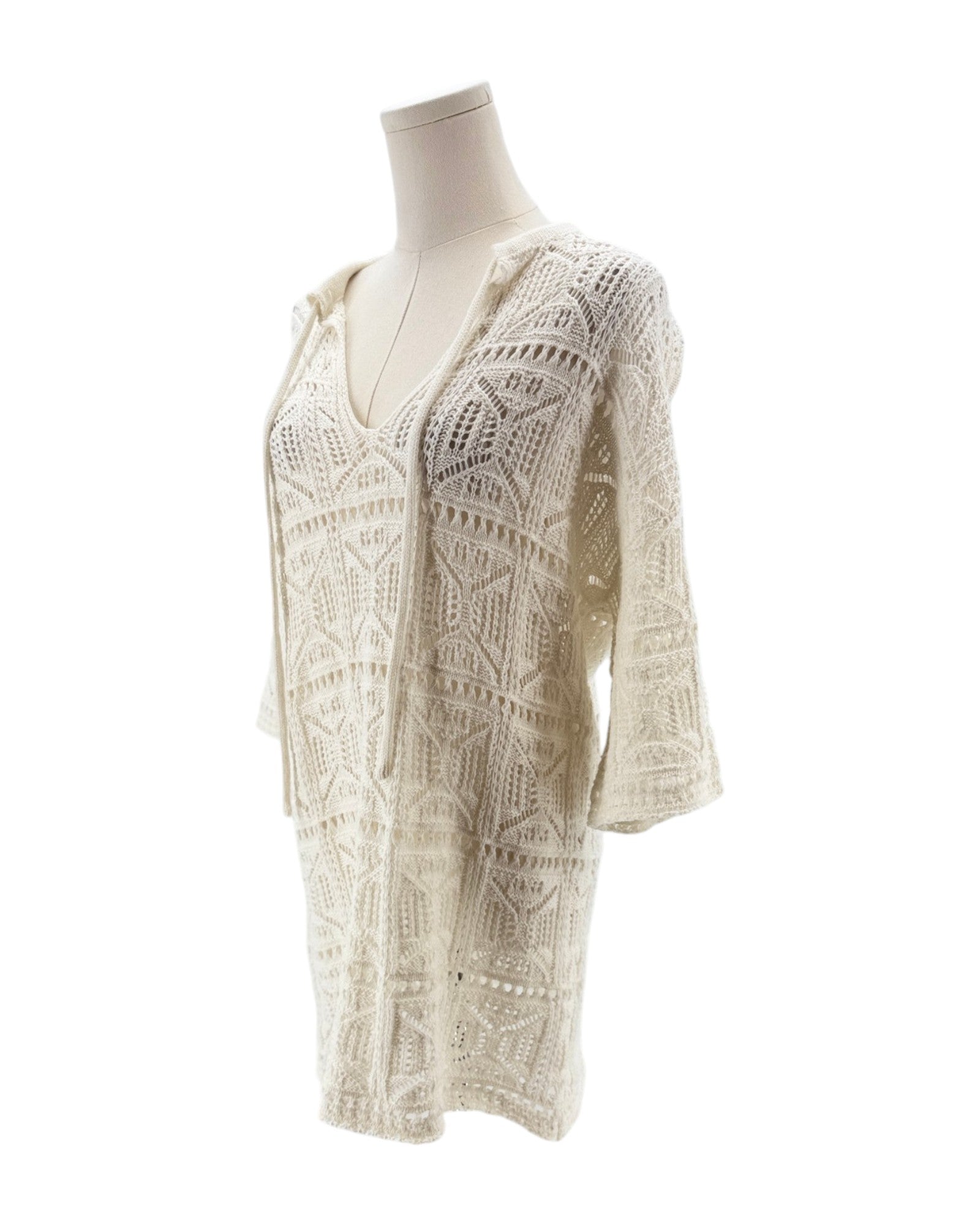 White lace dress on a mannequin against a white background