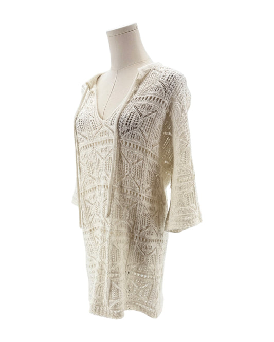 White lace dress on a mannequin against a white background