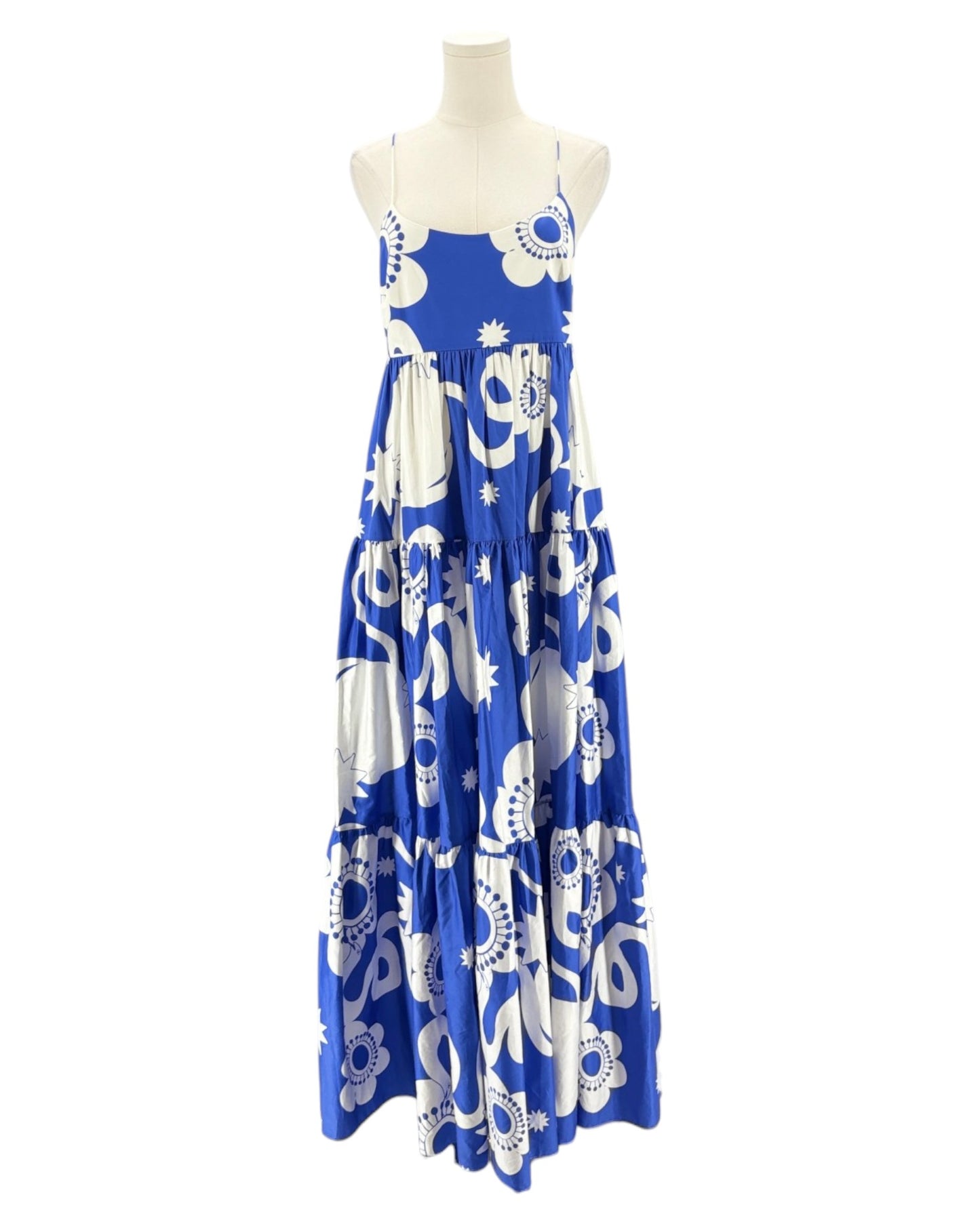 Blue and white patterned dress on a mannequin against a white background