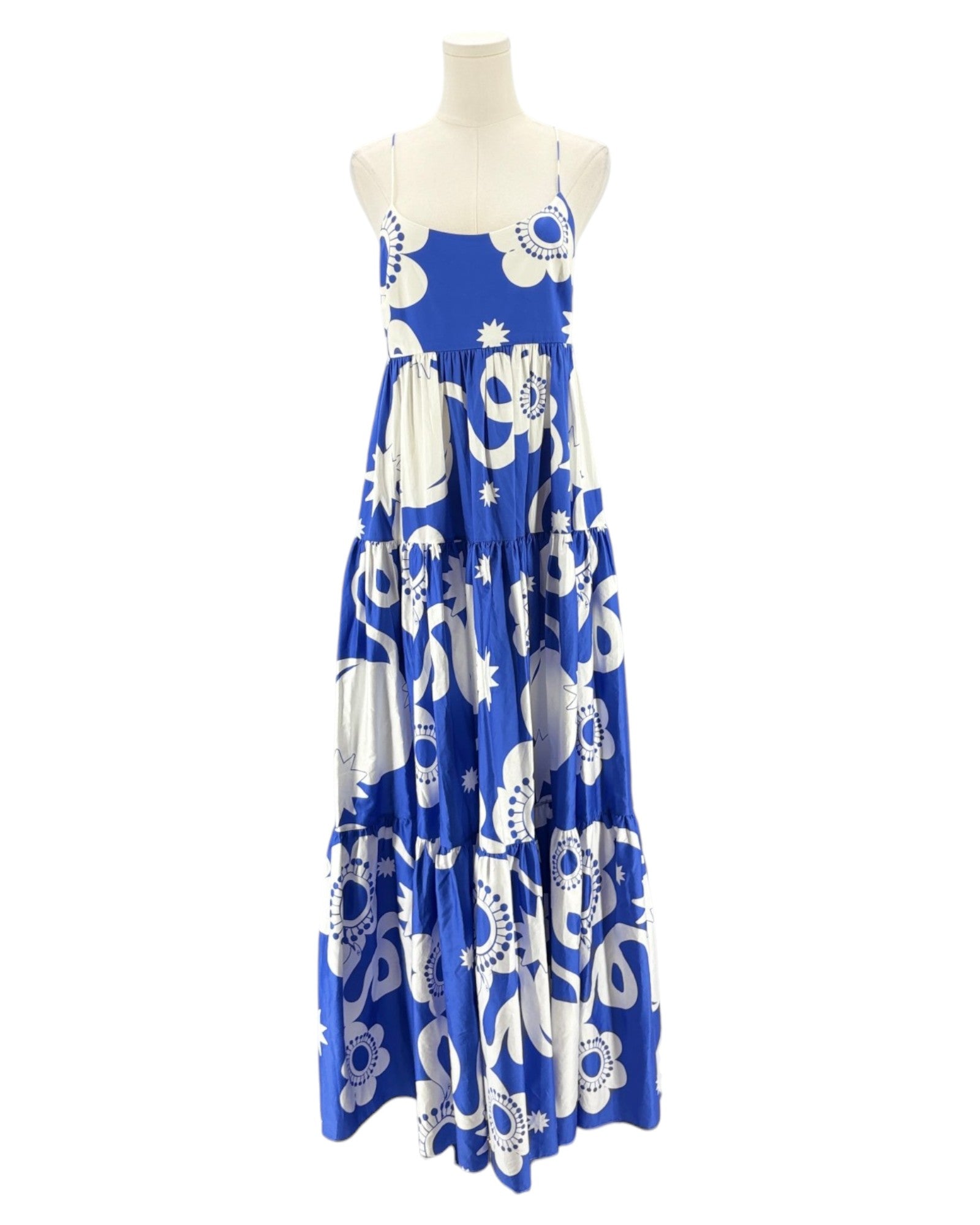 Blue and white patterned dress on a mannequin against a white background