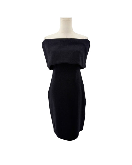Black off-the-shoulder neckline, crinkled jersey fabric, midi length dress on a mannequin on a white background