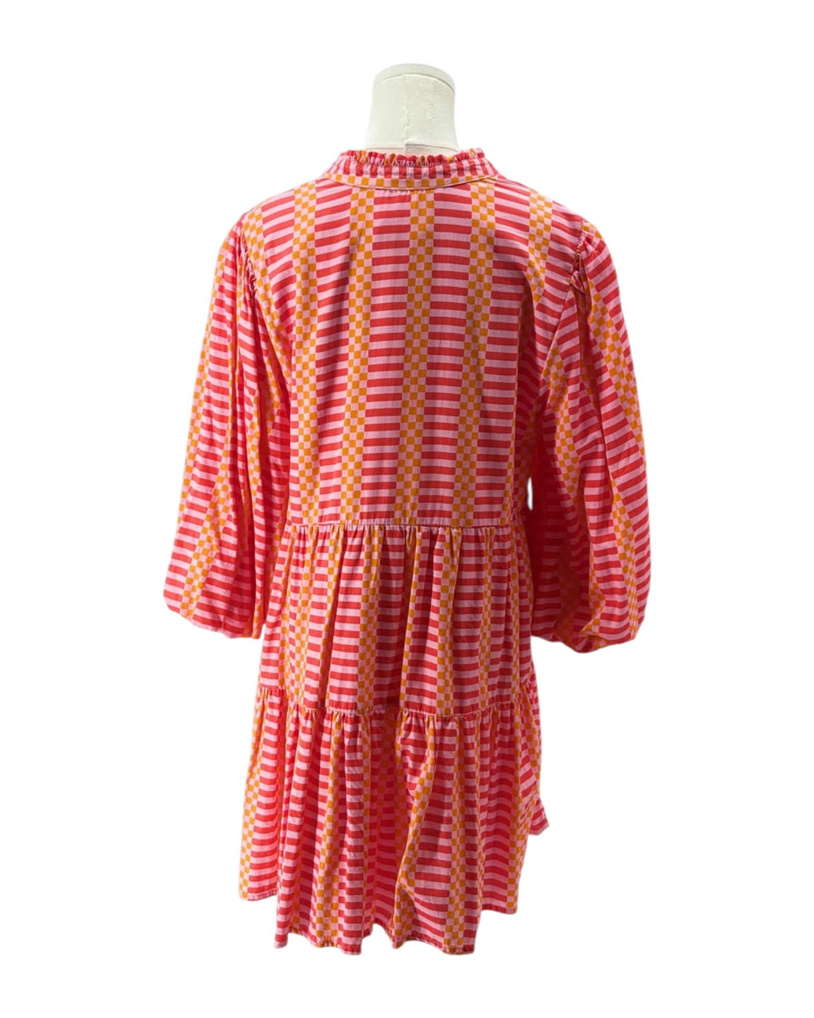 Pink and Orange striped dress on a mannequin against a white background