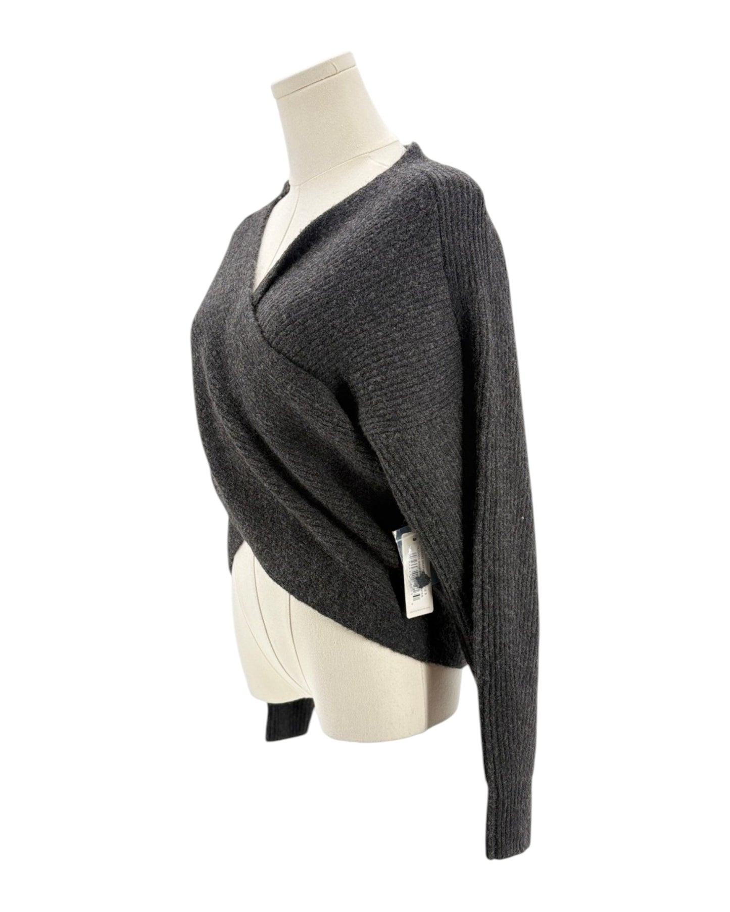 Gray knitted sweater on a mannequin against a white background