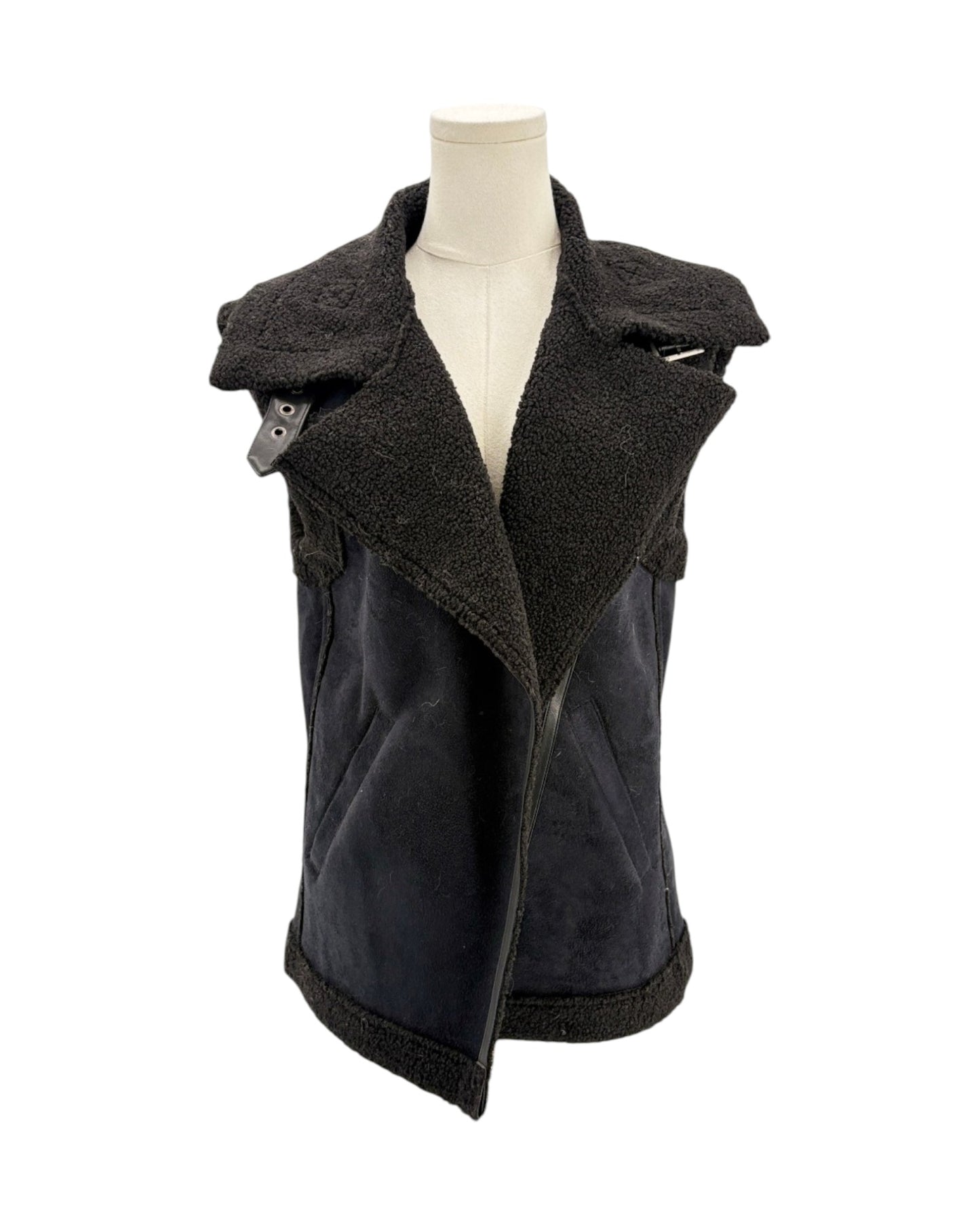 Black vest on a mannequin against a white background