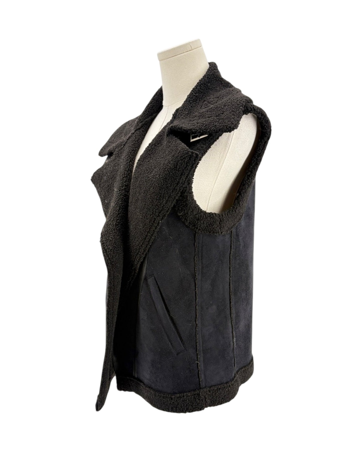 Black vest with fur lining on a mannequin against a white background