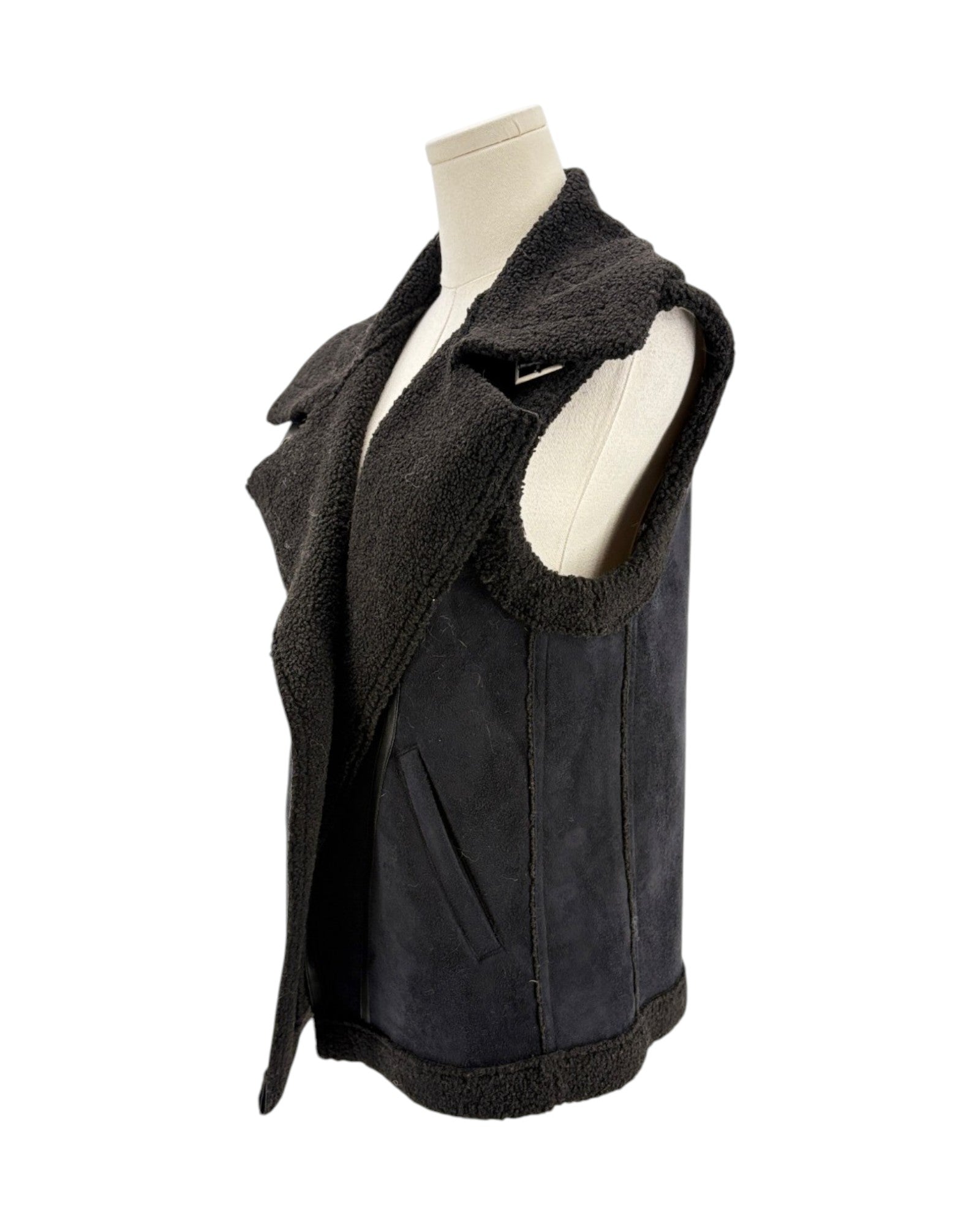 Black vest with fur lining on a mannequin against a white background