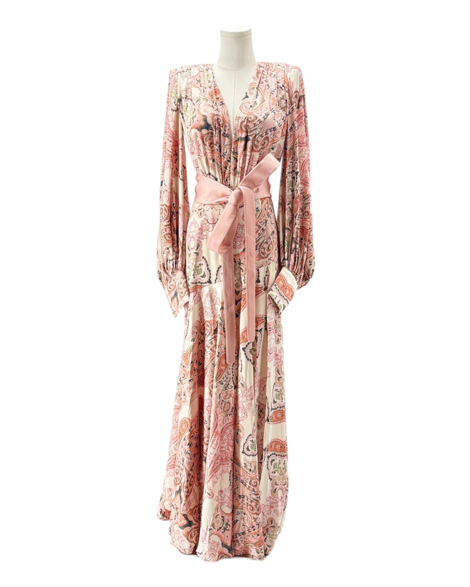 Long floral dress with a belt on a mannequin against a white background