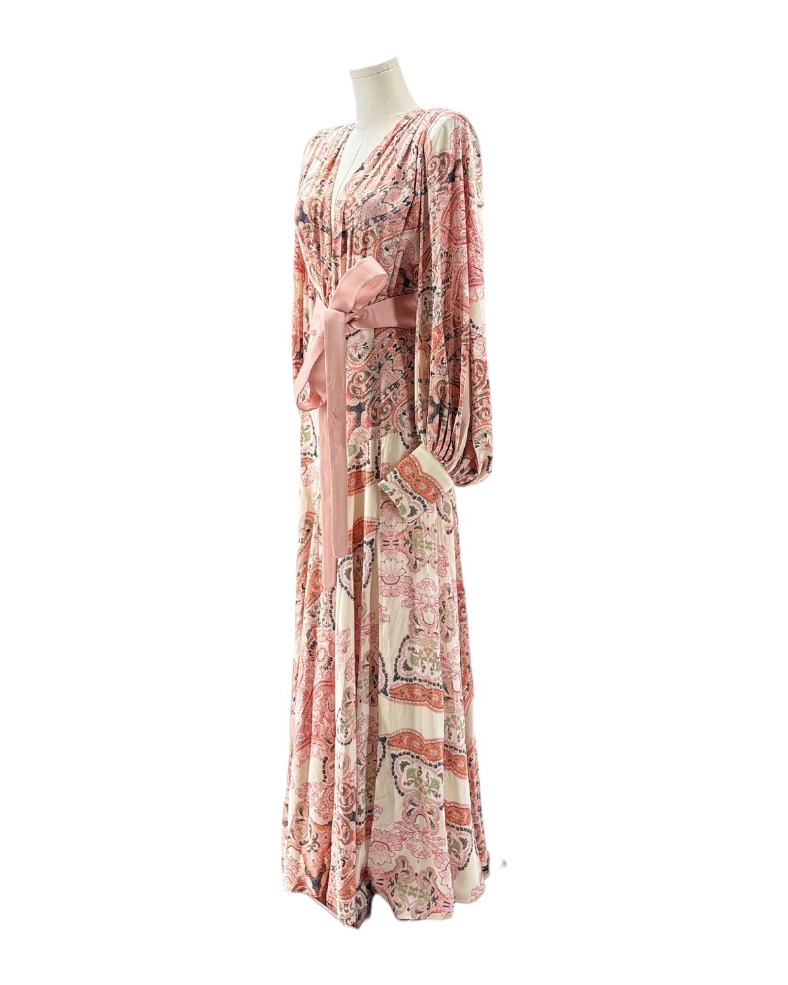 Patterned dress on a mannequin against a white background