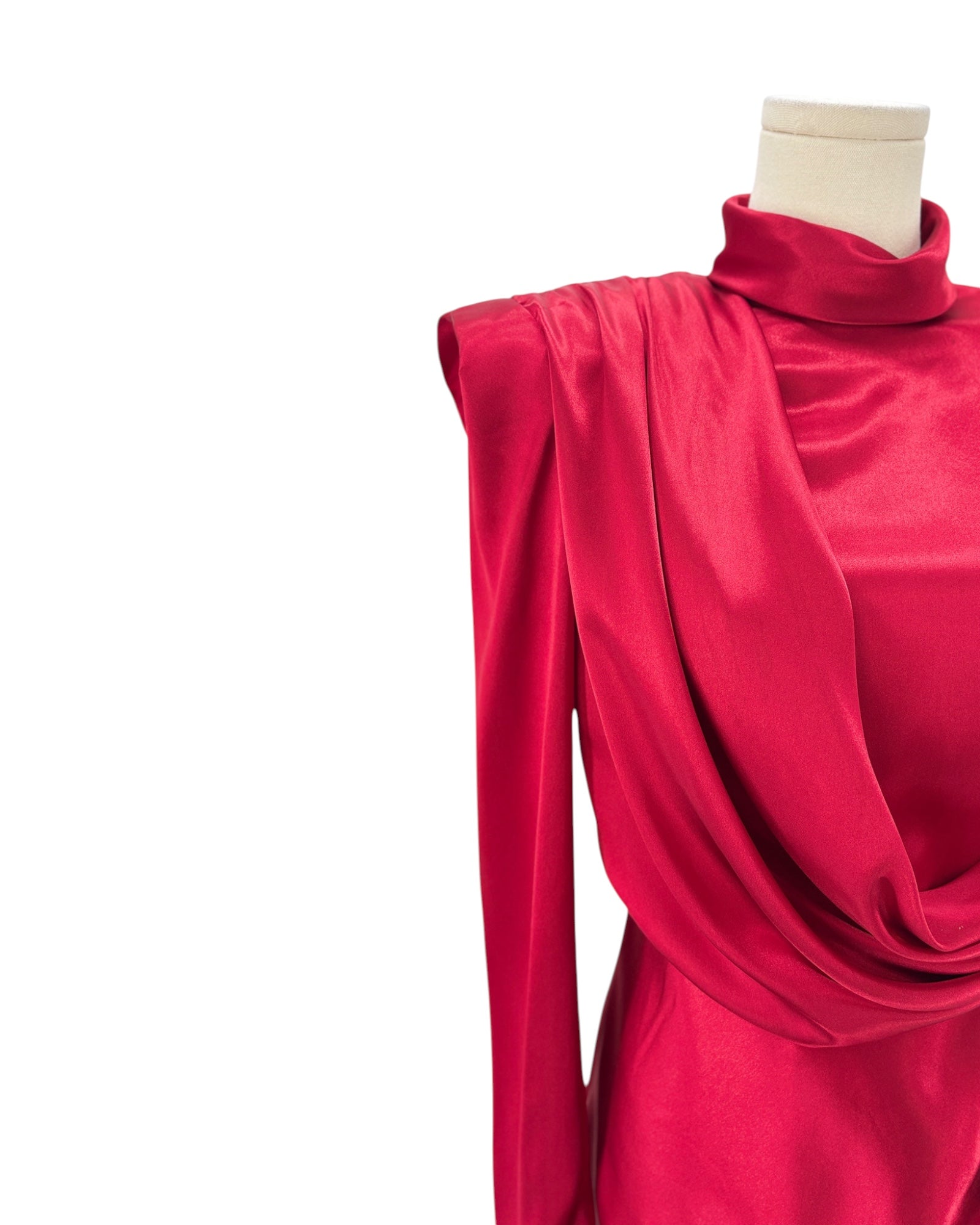 Red dress on a mannequin against a white background