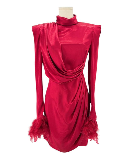 Red dress with feathered sleeves on a mannequin against a white background