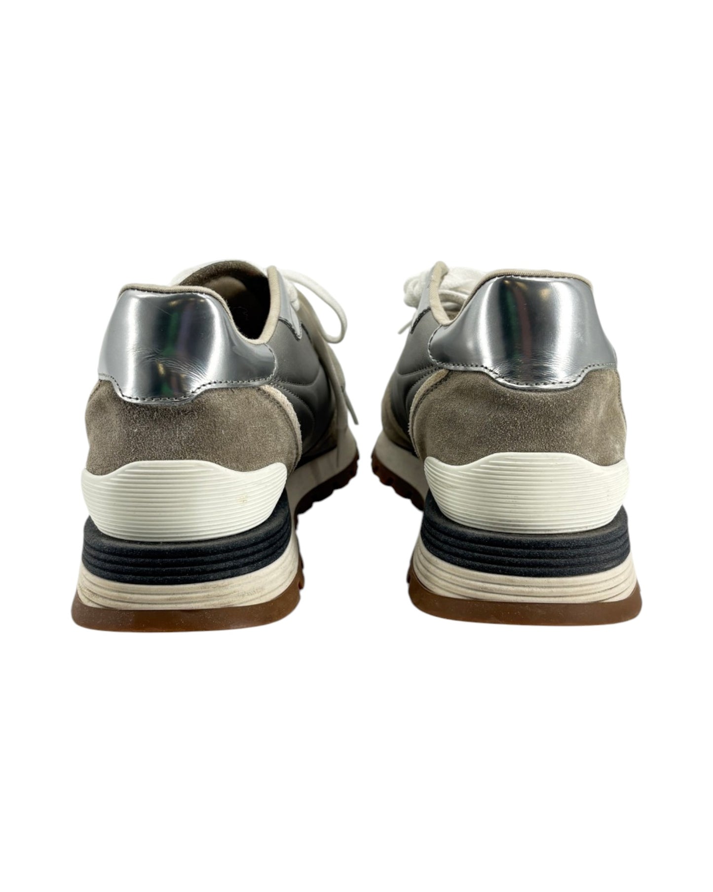 Pair of gray and silver sneakers on a white background