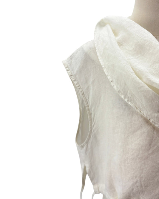Close-up of a sleeveless white linen top with a wide draped collar, shown on a mannequin against a white background.