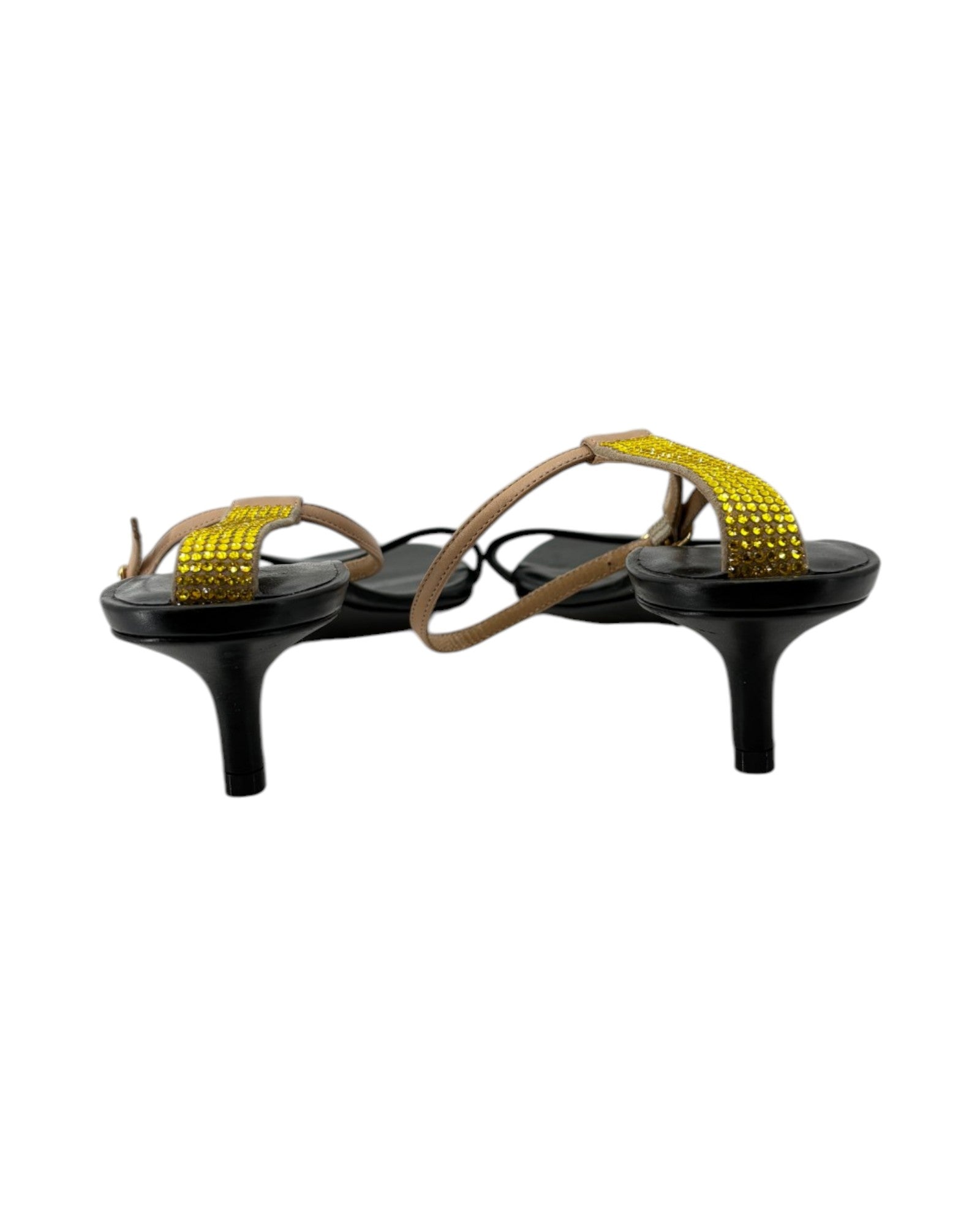 Black high-heeled sandals with yellow straps on a white background