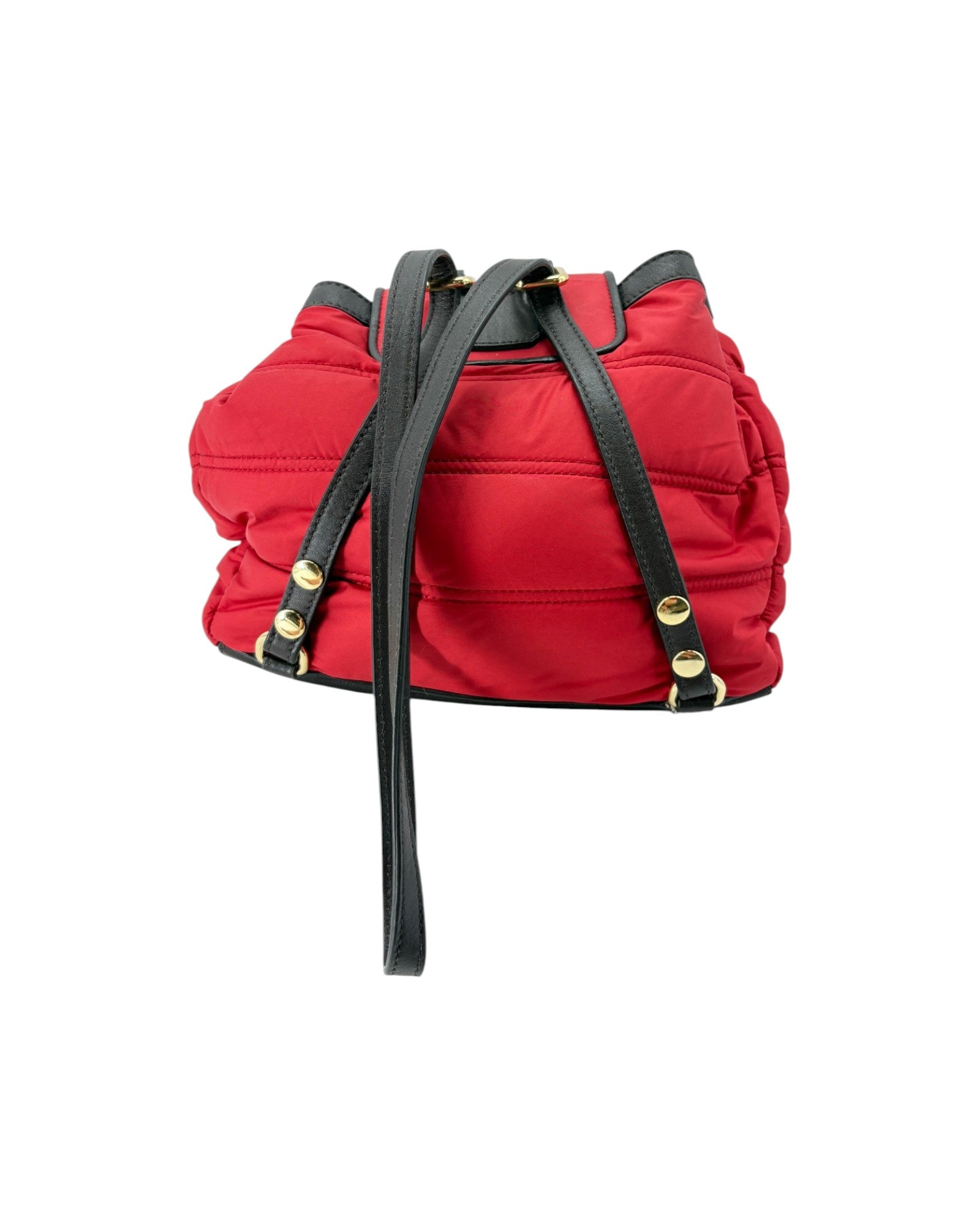 Red backpack with black straps on a white background
