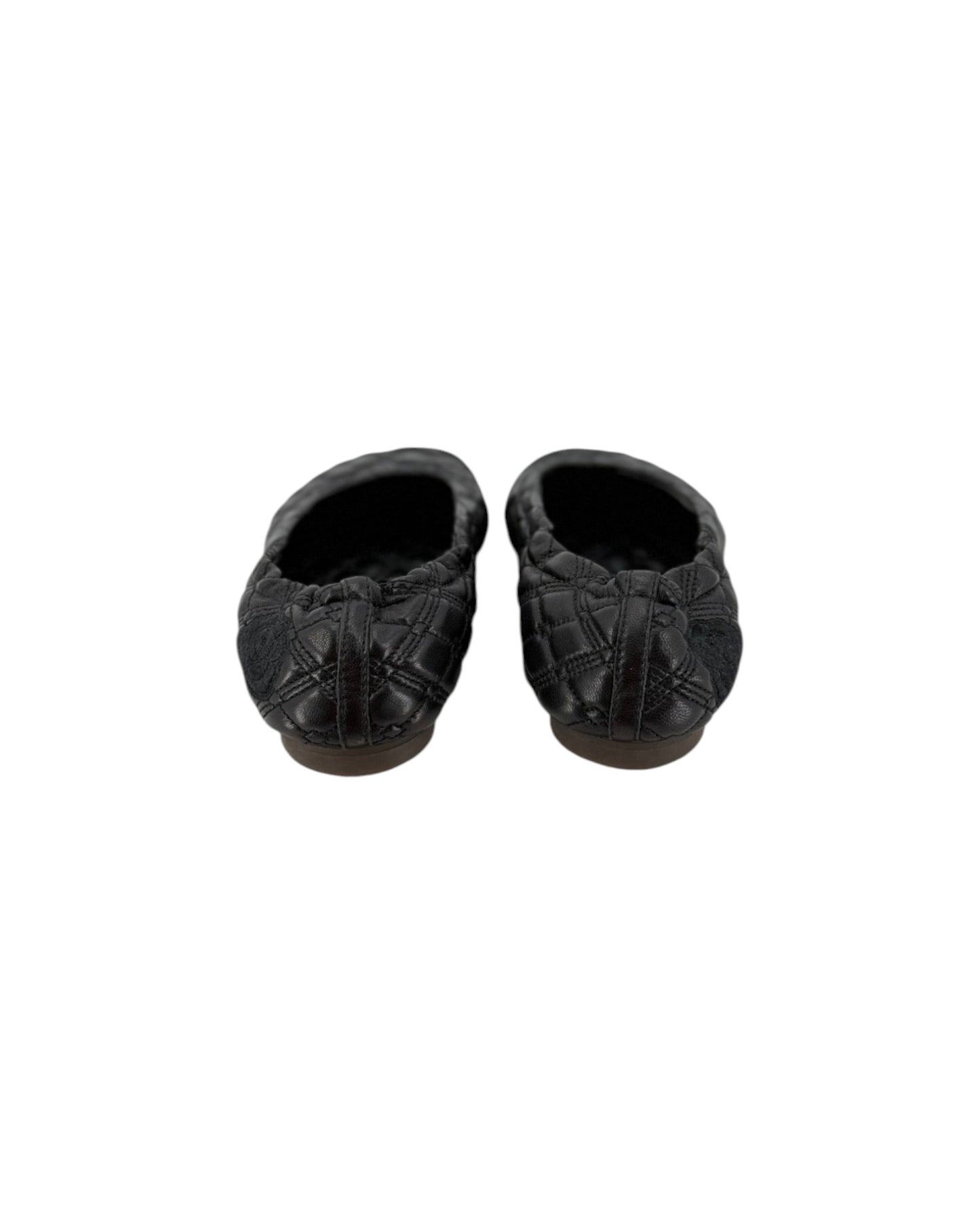 A pair of black quilted leather slip-on slippers with a textured pattern, shown from a top-down view on a plain white background.