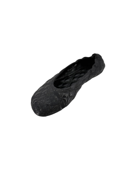 A single black ballet flat shoe with a textured quilted pattern, shown in profile against a plain white background.