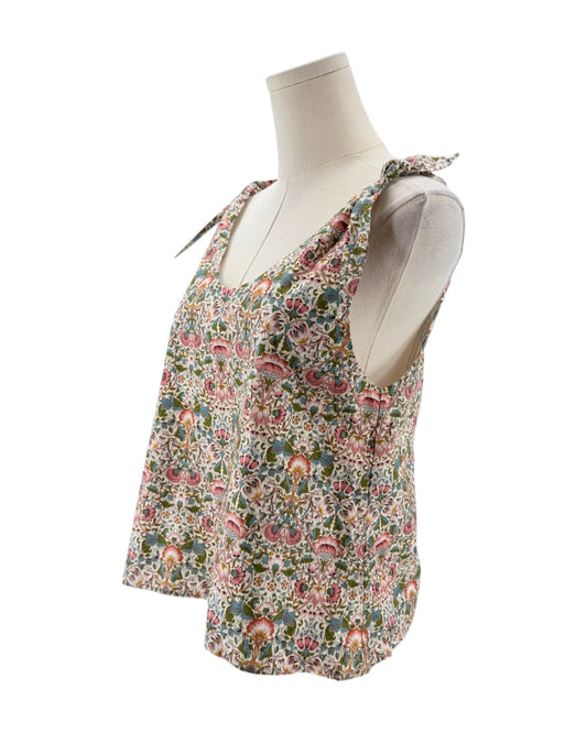 Floral sleeveless top on a mannequin against a white background