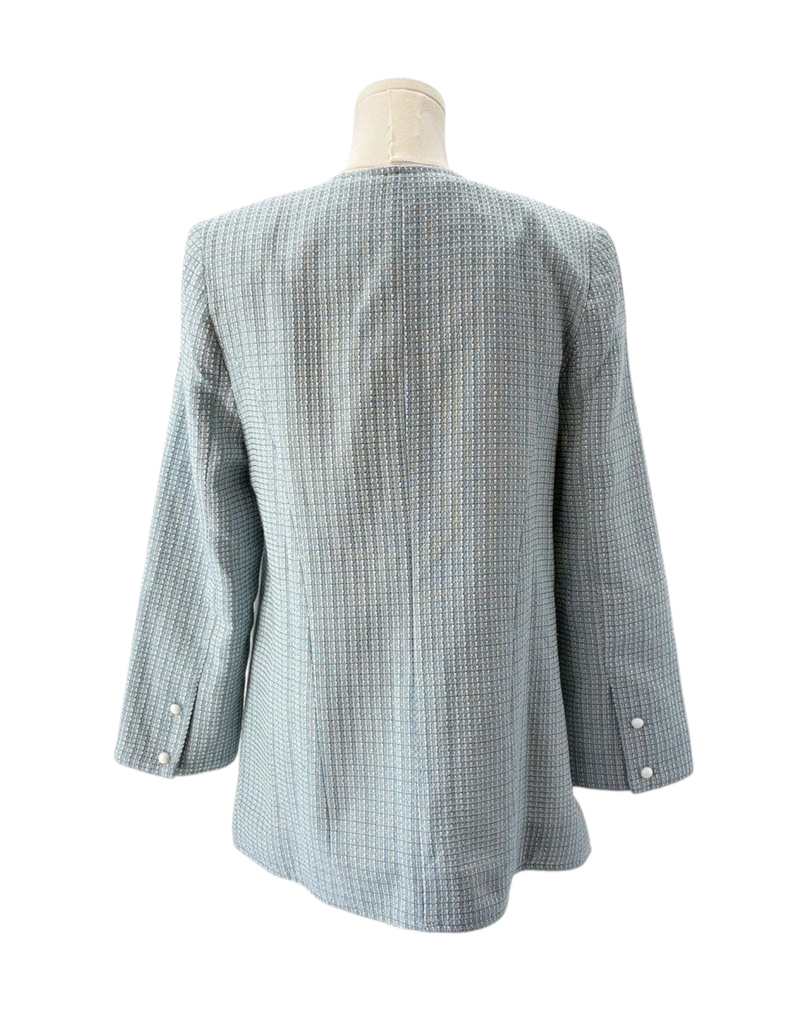 Blue tweed blazer on a mannequin against a white background