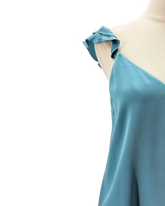 Teal top on a mannequin with a white background